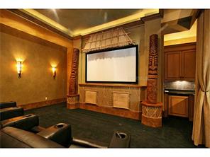 Media room with double tray ceiling, accent lights, wet bar and